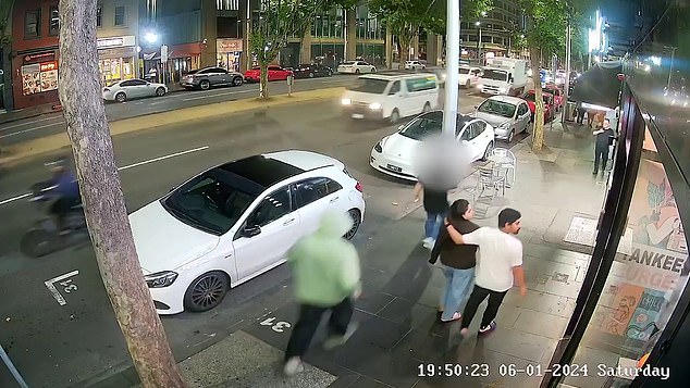 CCTV footage shows a man wearing a lime green hoodie and dark-colored cargo pants running after a 24-year-old man and stabbing him in the leg before running away