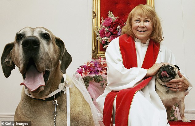 Charolette has officiated more than 500,000 weddings, including this unlikely combination of a Great Dane and a Pug