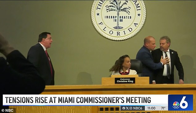 Commissioner Miguel Gabela (right), 59, jumped out of his chair and charged toward Commissioner Joe Carollo (left), 68, until a staffer rushed to stop him, bringing Thursday's meeting to an abrupt end