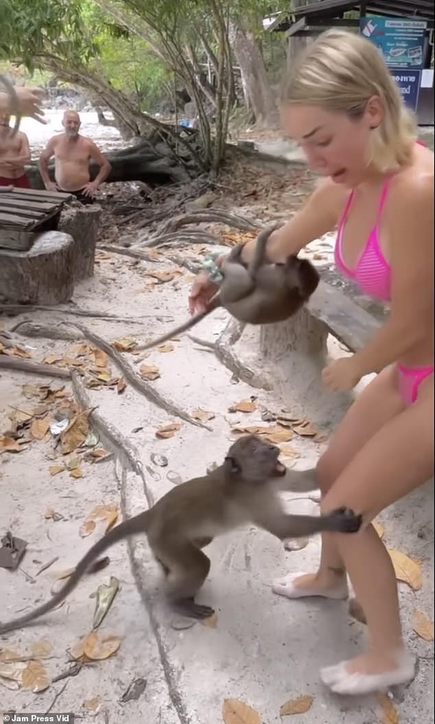 Emmy Russ (pictured, right) visited Monkey Beach on Thailand's Phi Phi Islands