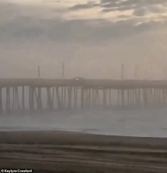 The taillights of the car were visible as it drove off the pier
