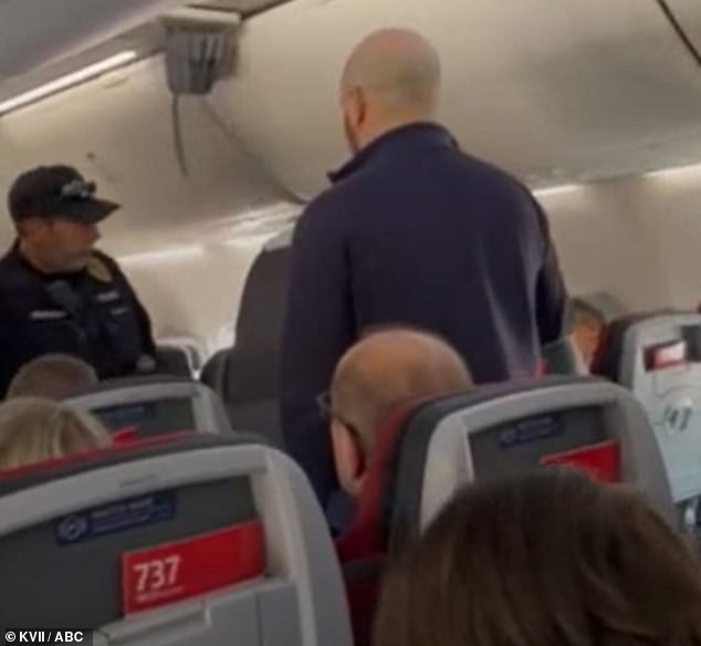 Officers approach the unruly passenger, identified as Keith Edwards Fagiana, after the pilots had to make an emergency landing in Amarillo, Texas