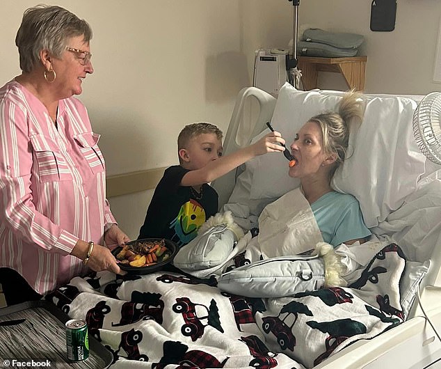 Lucinda Mullins, 41, had surgery to remove kidney stones but woke up when a quadruple amputee shared a touching photo of her youngest son helping her feed