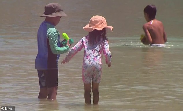 Perth's Ngarkal Beach almost became the scene of another tragic drowning on Wednesday.  Young beachgoers are pictured after the terrifying emergency