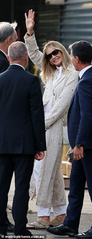 Elle seemed cheerful as she greeted several airport employees before boarding her waiting limo