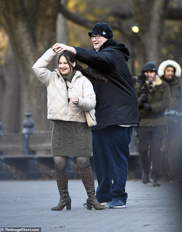 Gypsy Rose Blanchard, 32, is all smiles as her husband, Ryan Anderson, spins her around Central Park during a visit there on Friday