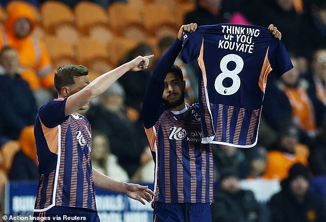 Nottingham Forest defender Andrew Omobamidele held up a number 8 shirt with the words 'thinking of you, Kouyate' after scoring against Blackpool