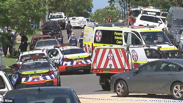 Police fired multiple shots, killing a man who pulled a gun on a doctor at a medical center in Nowra before approaching officers on the street outside (scene pictured)