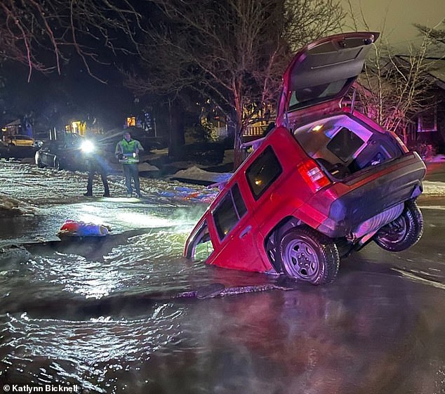 While driving home from Taco Bell, an Oregon couple was sent into a 12-foot sinkhole filled with water after the water-covered road crumbled beneath their Jeep.