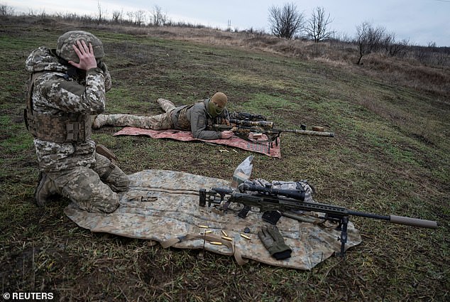 Ukrainian Army snipers practice shooting at a shooting range near a front line, amid the Russian attack on Ukraine, in the Donetsk region, Ukraine, December 23, 2023