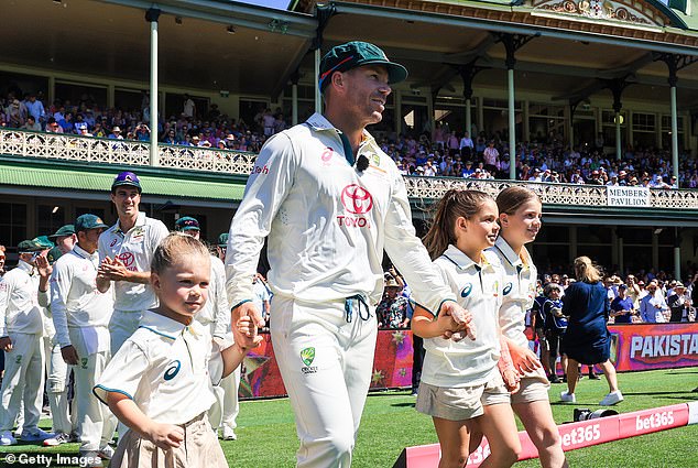 Warner is playing his final test for Australia at the SCG and walked onto the famous pitch with his three daughters for the start of play on Wednesday morning (pictured)