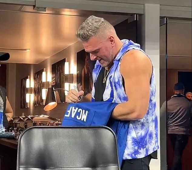 Pat McAfee was signing autographs for fans during the game against the Indianapolis Colts on Saturday