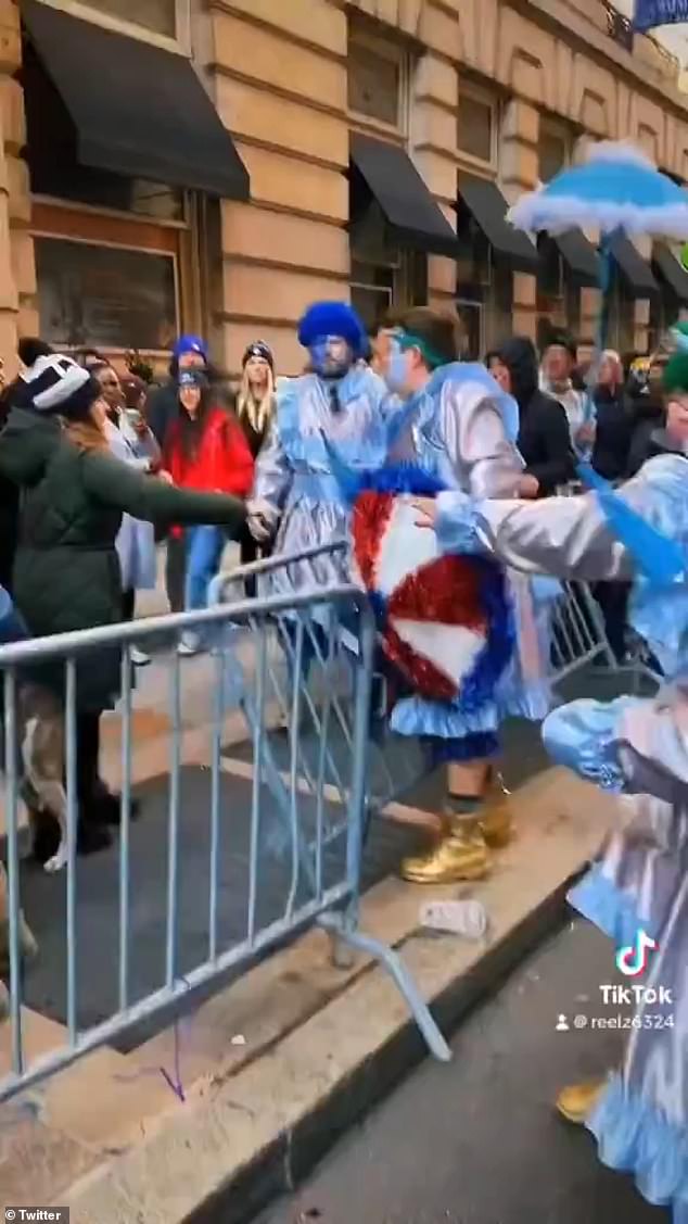 The brawl broke out between the spectator and the mummer around 2:30 p.m. during the annual Mummers Day Parade on Monday in Philadelphia.