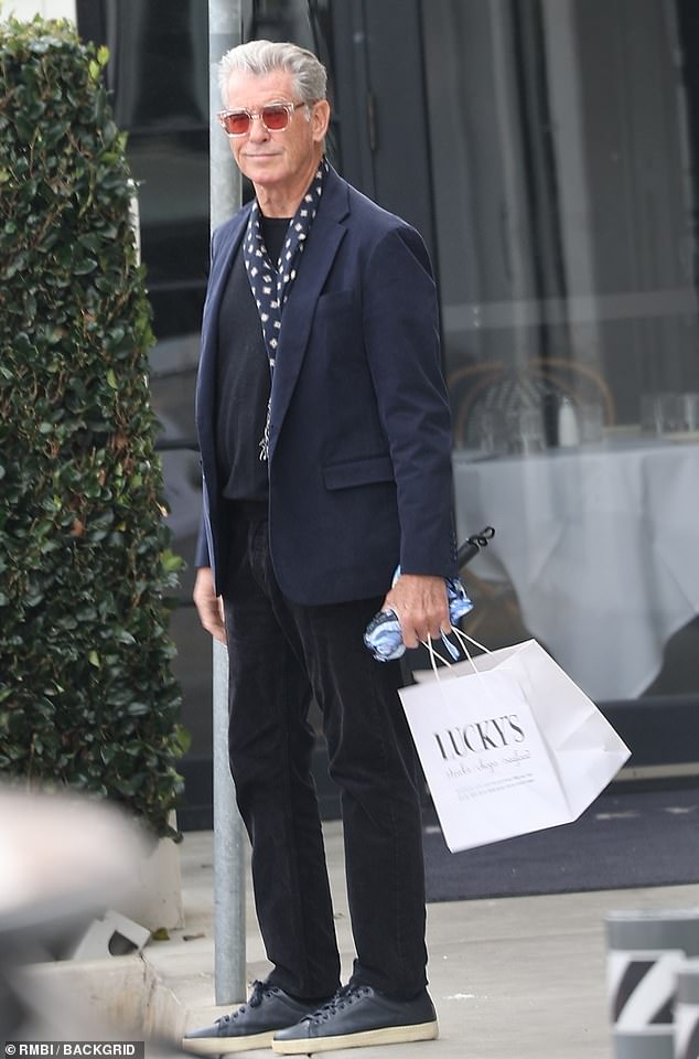 Pierce seemed untroubled by his legal troubles as he smiled broadly after enjoying lunch at Lucky's restaurant in Malibu, California