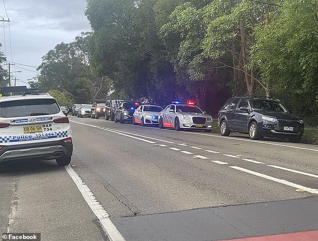 Police broke up a National Socialist Network meeting in North Turamurra on Saturday evening (photo, police cars on site)