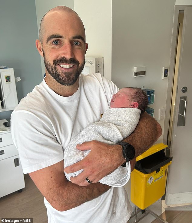 Steele Sidebottom is seen cradling his newborn son Ned, who arrived a little prematurely after his mother Alisha suffered a health tragedy during her pregnancy