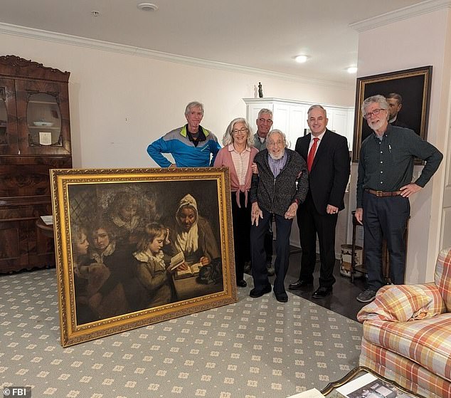 The son of Dr.  Earl Leroy Wood, Dr.  Francis Wood, received the painting stolen by the FBI on January 11, 1969.  In the photo: Francis and his children with the painting