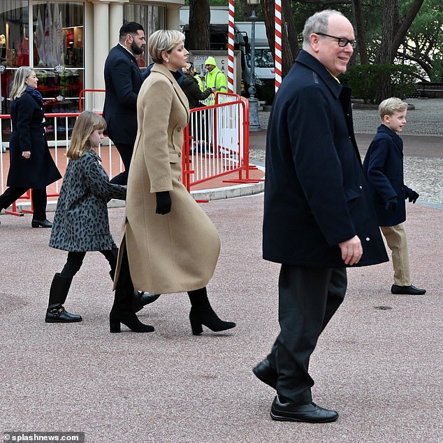 The royals walked down the street after the Circus Parade and smiled at the crowd after their family day out