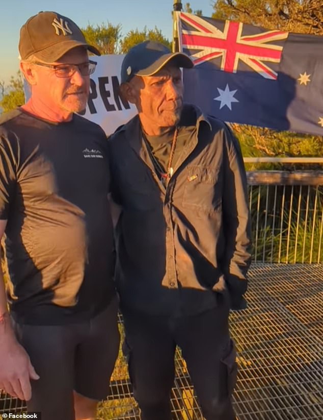 Marc Hendrix (left), author of A Guide to Climbing Mt Warning, and Ngarakbal elder Sturt Boyd (right) during Friday morning's protest atop Mt Warning