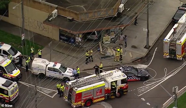 The 52-year-old driver is said to have given an alcohol breath test of 0.133, almost three times the legal limit (photo, emergency services on site)