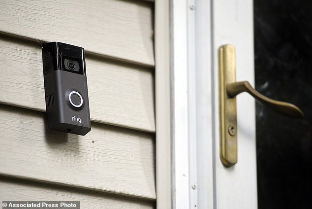 A Ring doorbell camera is seen outside a house.  From this week, the camera images will not be shared with the police if they request it