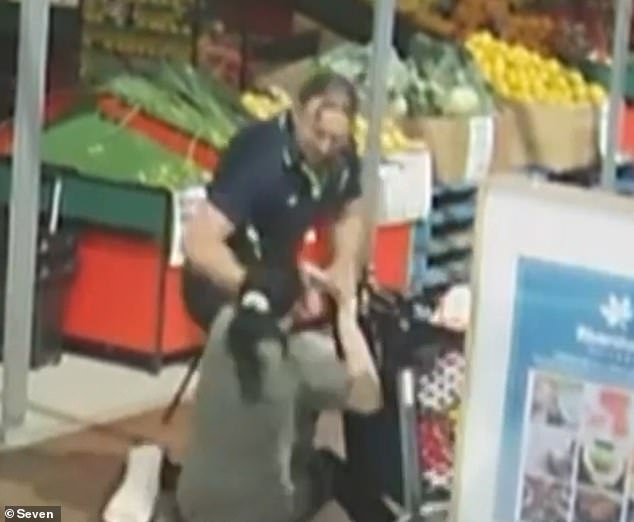 A heroic supermarket manager was rushed to hospital after he was allegedly stabbed by shoplifters