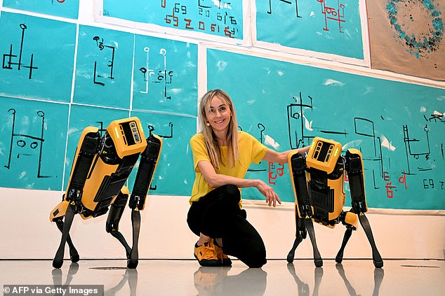 Agnieszka Pilat's robotic dogs, Basia, Bunny (pictured above), and Fania's paintings are on display at an exhibition in Australia