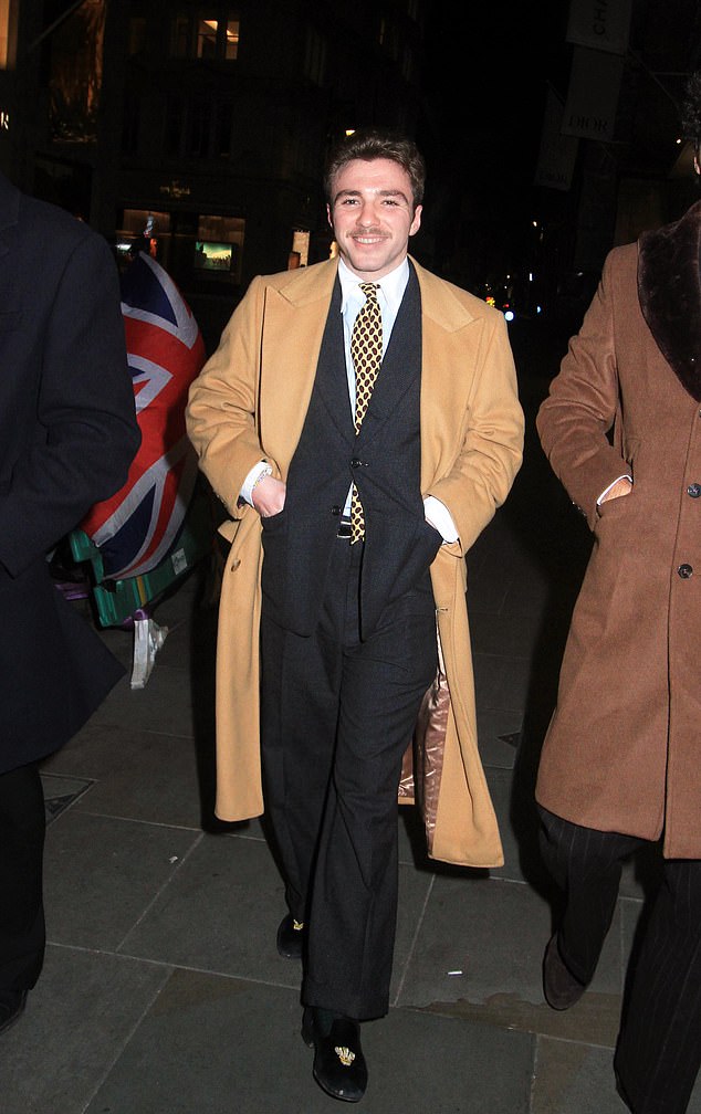 The well-dressed 23-year-old paired a dark suit with a polka dot tie for the outing