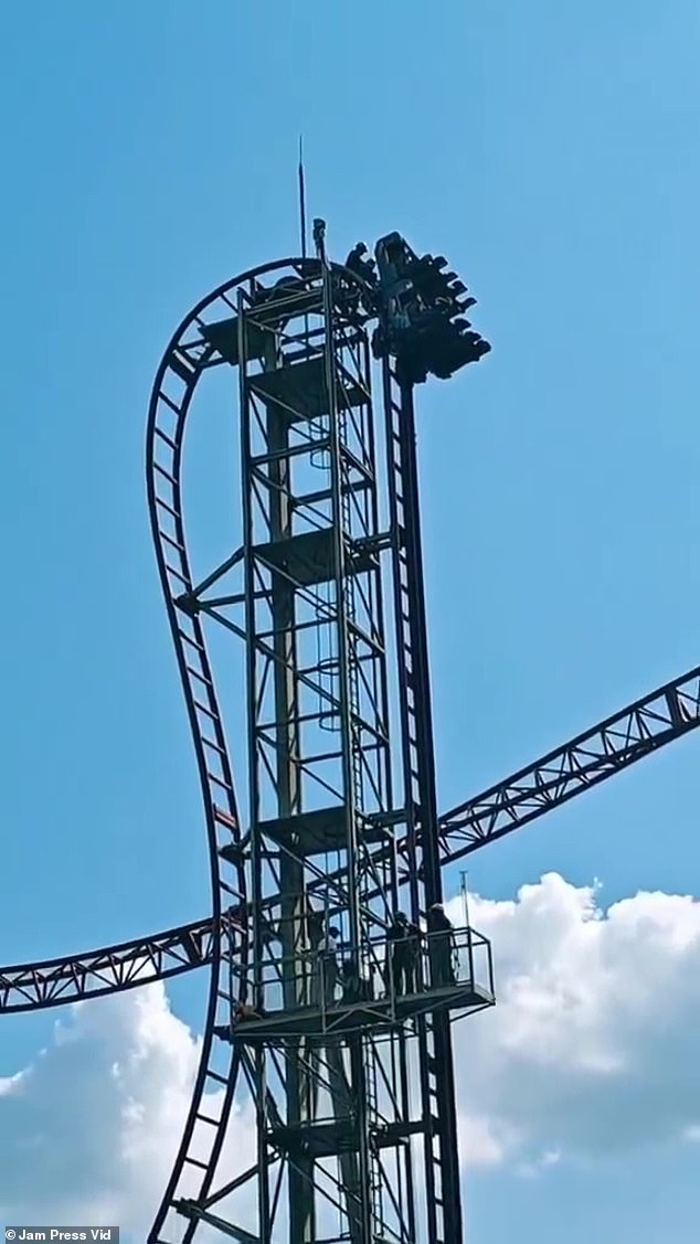 Other park patrons captured the moment the thrill seekers were rescued by emergency services using a service elevator (photo below)