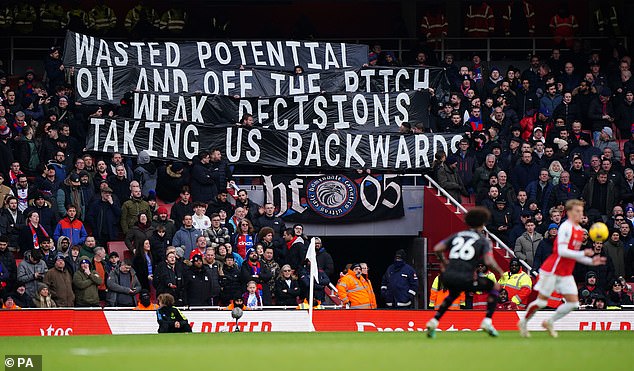 Eagles fans expressed their frustrations with the club via a banner during their match against Arsenal