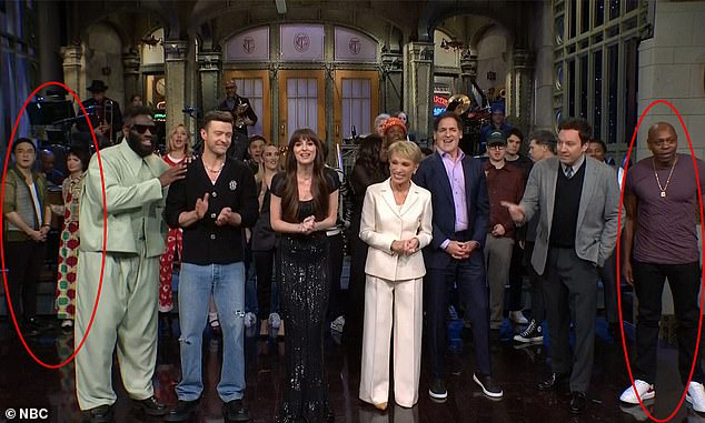 Eyed viewers noticed Saturday Night Live's Bowen Yang (pictured left) standing as far away as possible while comedian Dave Chappelle made a surprise appearance during the episode's closing credits last week