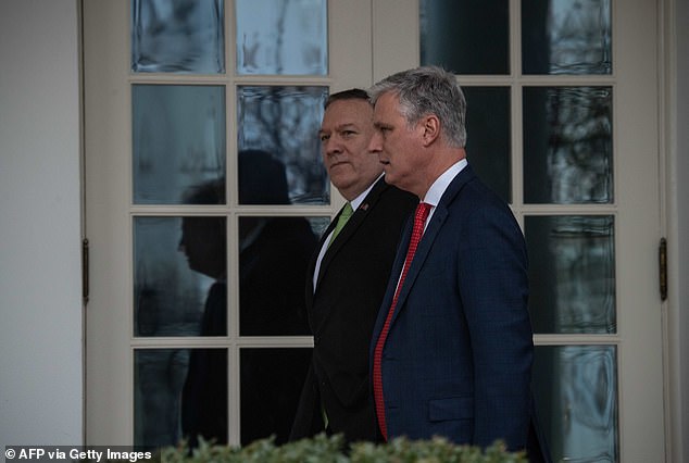 Mike Pompeo (left) and Robert O'Brien (right) walk together in 2020, when both were serving the Trump administration