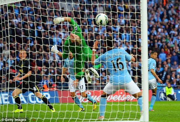 Ben Watson's header went past Manchester City goalkeeper Joe Hart at Wembley in 2013