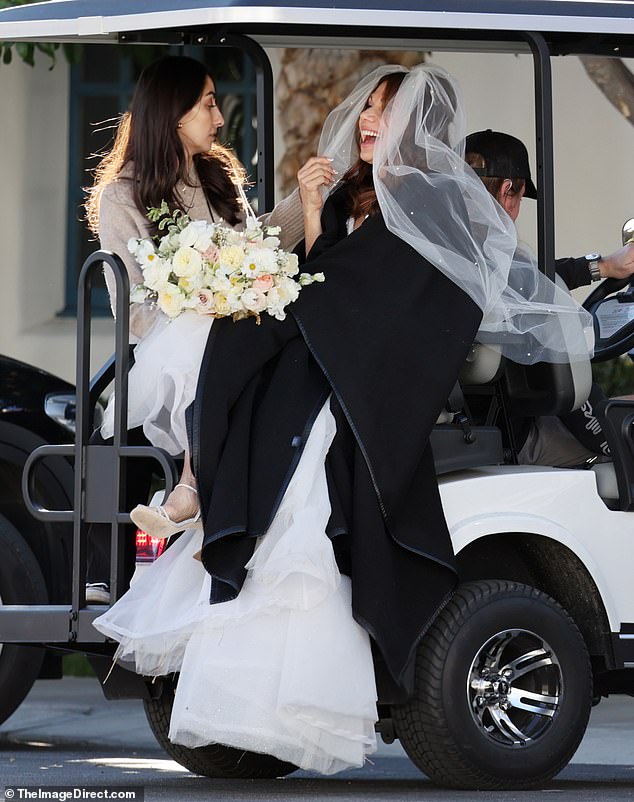 Exclusive photos from Dailymail.com show the glamorous septuagenarian riding a golf cart in a frothy tulle confection designed by New York fashion house Badgley Mishka