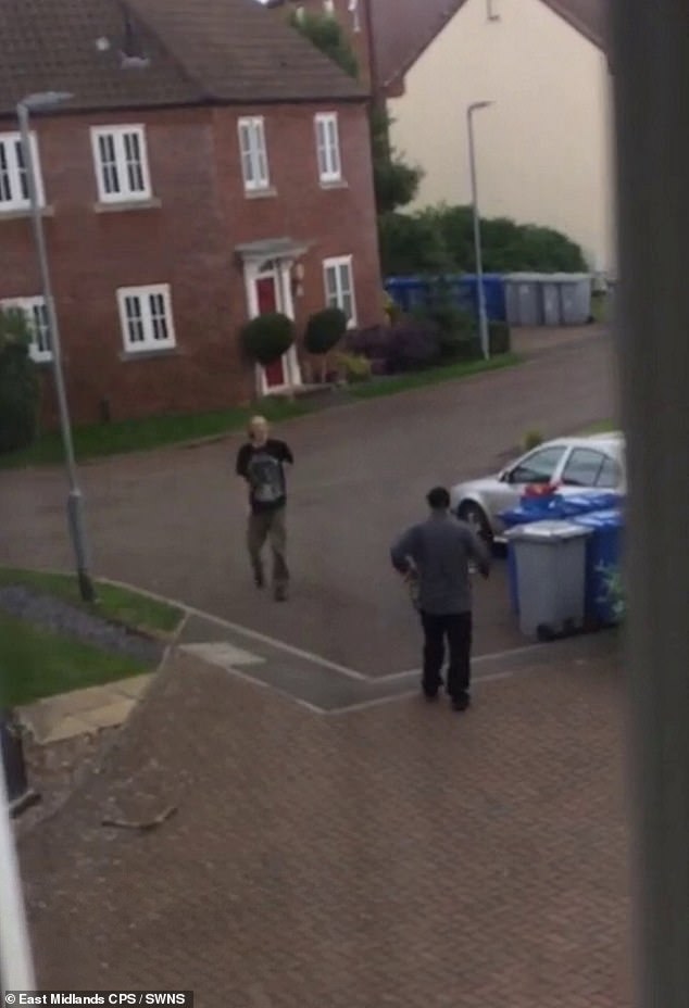 Dean Nicholas (grey jacket), 51, threw the hand scissors at Paul Benton (black shirt) after an argument outside their homes in the quiet cul-de-sac of Ashby Close in Northamptonshire