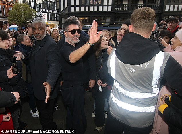 Simon Cowell was mobbed by fans on Sunday as he arrived with Amanda Holden for another day of auditions for Britain's Got Talent at the London Palladium