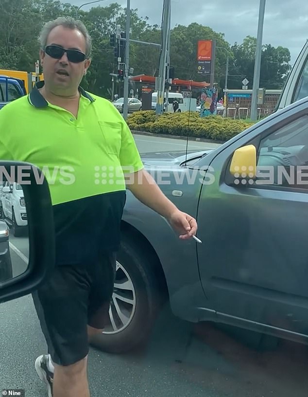 A Gold Coast truck driver was caught on camera charging at another motorist in a road rage incident on Wednesday