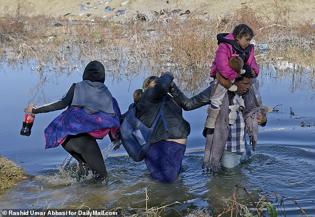Migrants cross the Rio Grande from Juarez, Mexico to the US on December 31