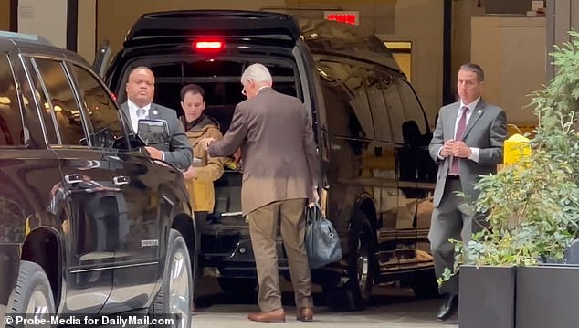 The former president, 77, looked stony-faced Thursday as he retrieved his belongings from a black truck