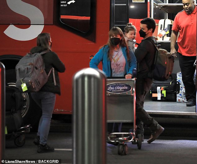 After the group collected their bags, they all boarded a transfer bus to their next destination