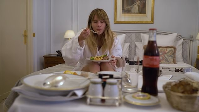 Resting: Model Ms Waterhouse is seen eating in her latest YouTube video