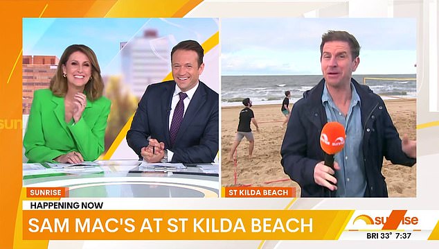 'Sam Mac is in Melbourne this morning.  He's on the beach in St Kilda looking...pretty good,” Nat says as she walks over to Sam's weather report