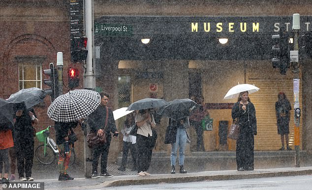 More rain is heading towards Sydney on Wednesday after heavy falls on Monday caused major damage to commuters on their way to work (pictured)