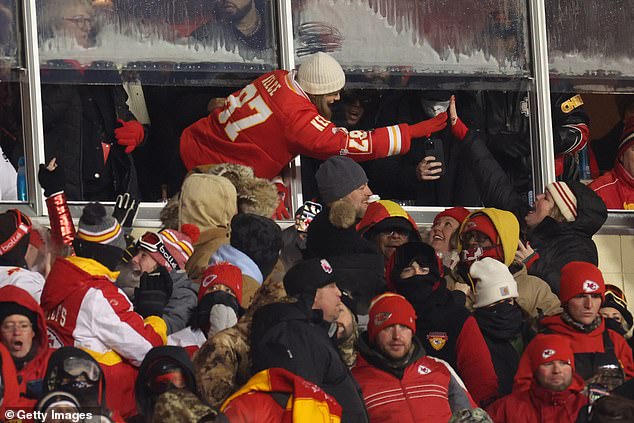 Taylor Swift gave Chiefs fan Beth Vancil (pictured giving the singer a high five) her scarf during the game