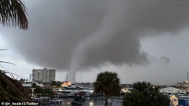 Video from the South Florida city shows the large tornado moving close to the center