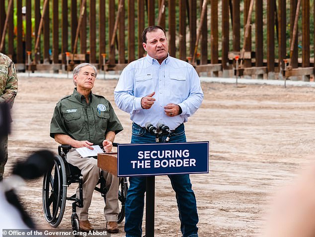 Texas Border Czar Mike Banks (center, with Texas Governor Greg Abbott) defied the federal government when he told ranchers they could have razor wire installed on their properties for free