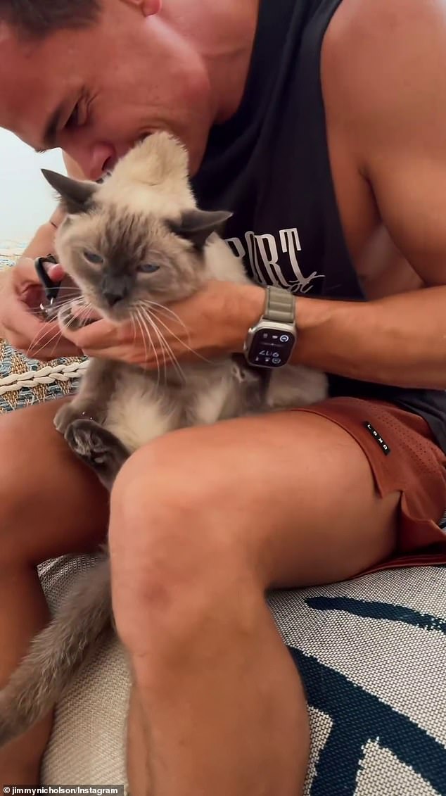 The former reality star shared a video on Instagram of himself preparing to give one-year-old Raffy's claws a much-needed trim.  Jimmy is seen lightly biting his cat's scruff to get him into position and then cutting his claws with scissors