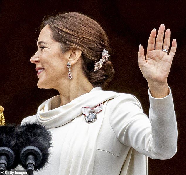 Mary wore the order pin of the royal family of Queen Margrethe II.  She will soon be the first to receive Frederik's order, in which his portrait will be framed with 200-year-old diamonds