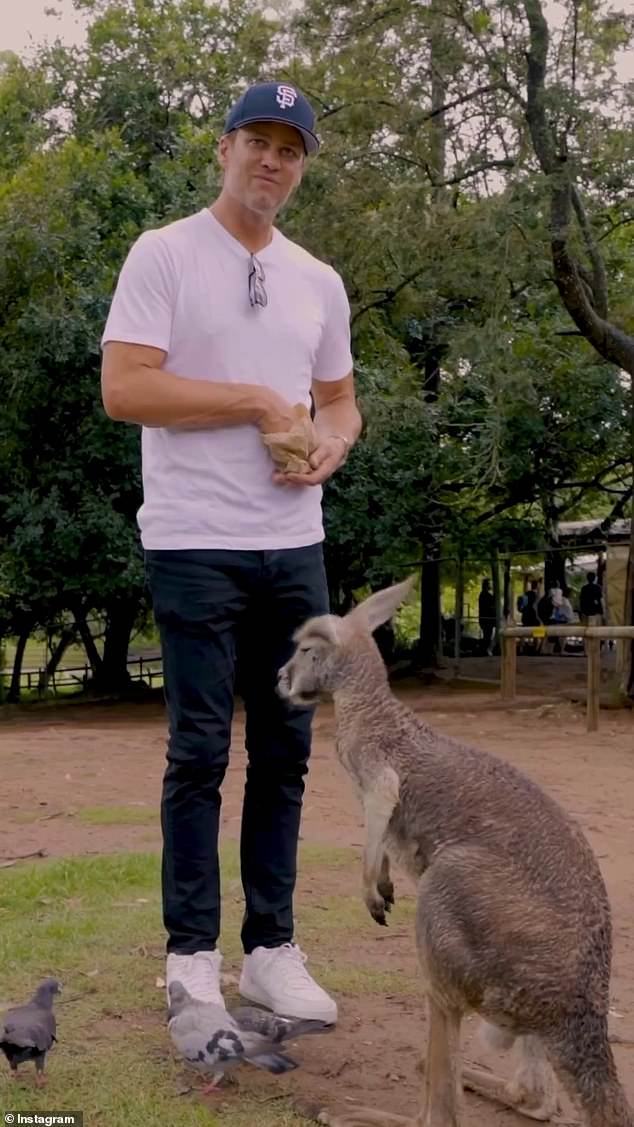 NFL legend Tom Brady, 46, (pictured) took some time off from speaking engagements in Melbourne and Brisbane last week to meet some furry friends