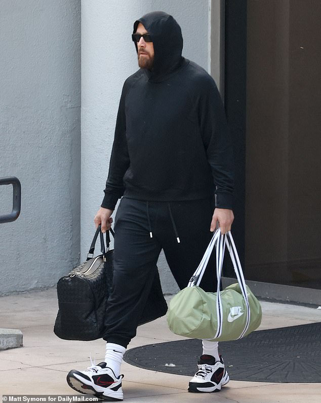 Travis Kelce looked glum as he left the team hotel in Los Angeles